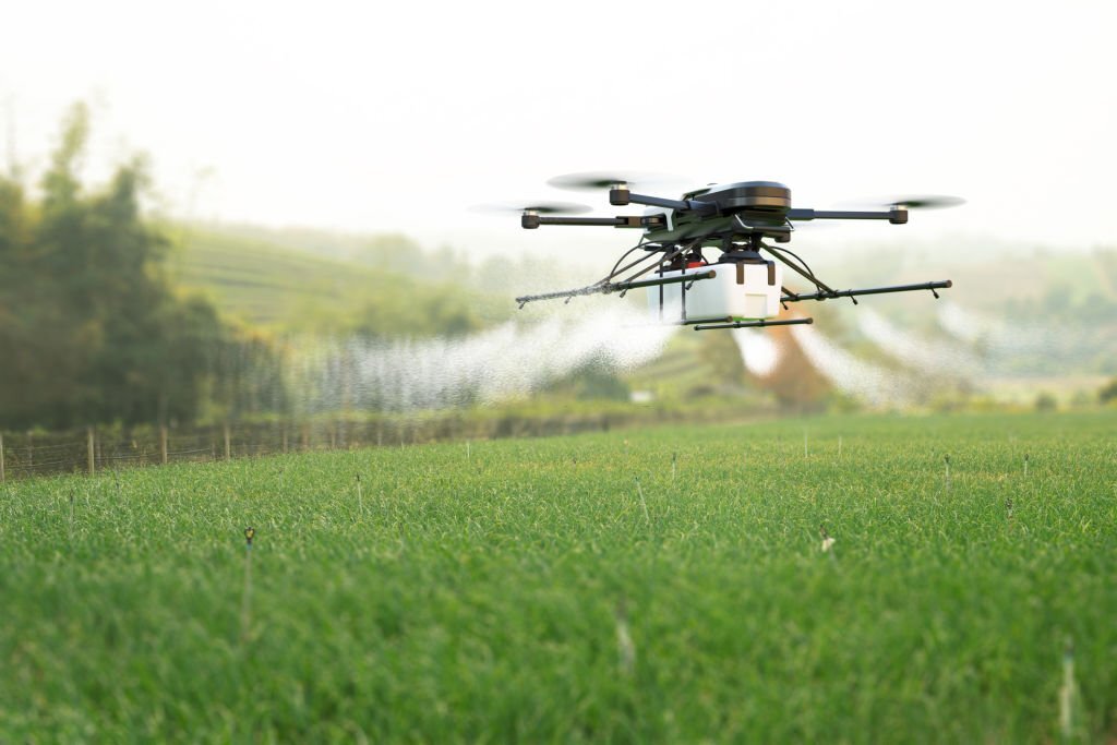 drone flying over agricultural field