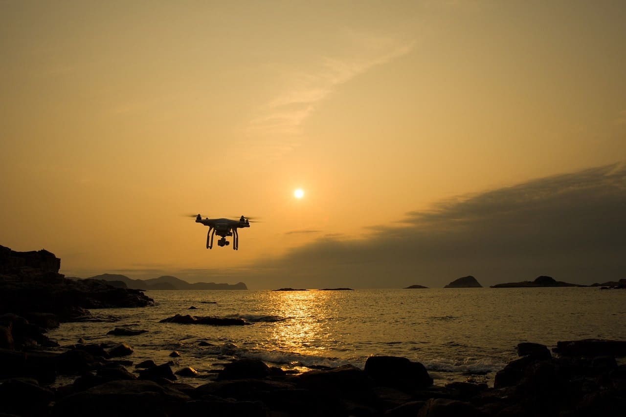Drone flying near the ocean