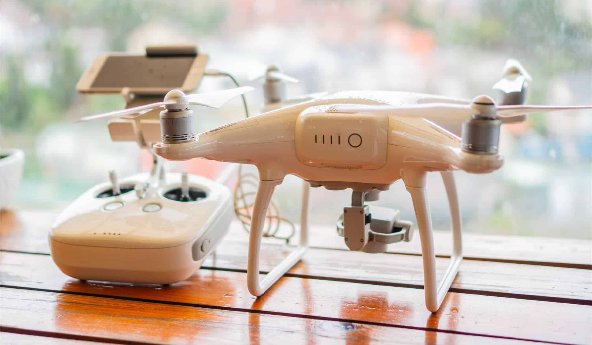 Drone and controller on top of a wooden table